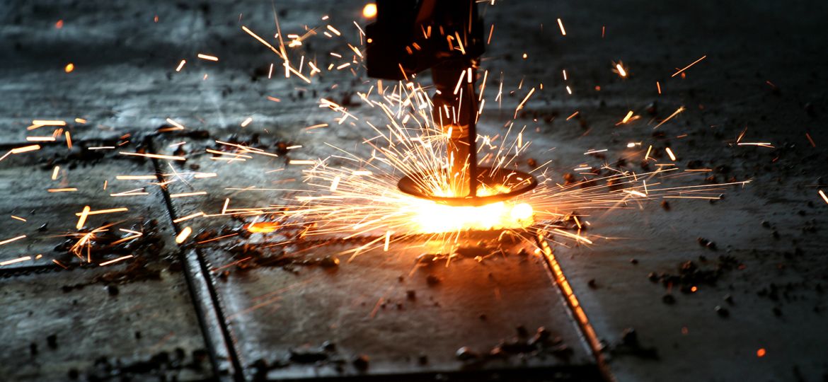 Industrial Laser cutting metal with sparks